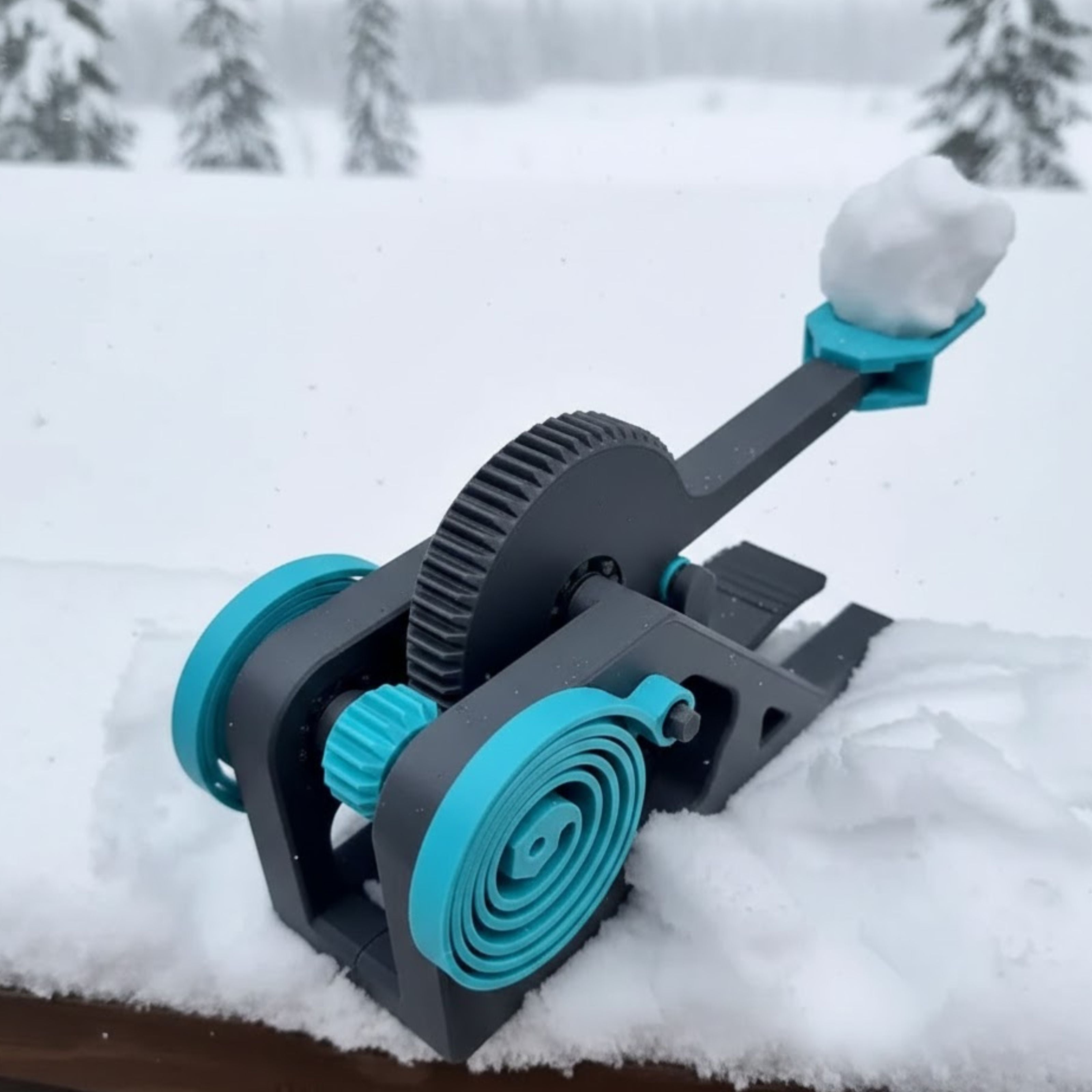 Snowball maker machine in the snow with a snowy background