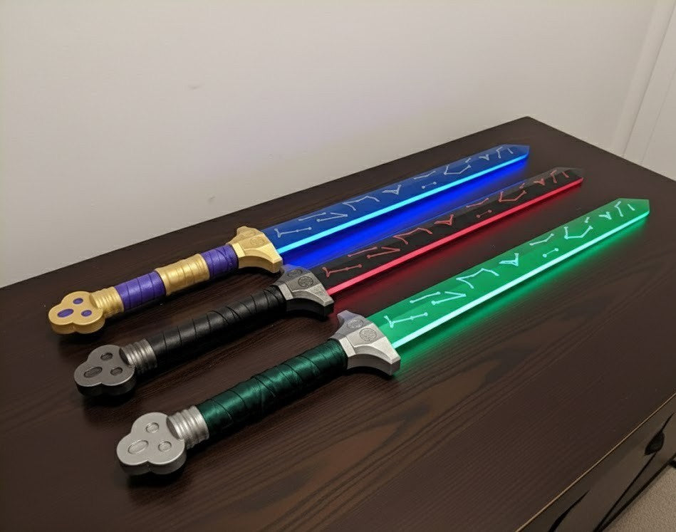 Three colorful toy swords on a wooden surface