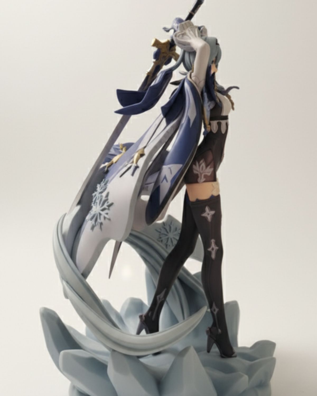 Animated character figurine with snowflake design on a white background
